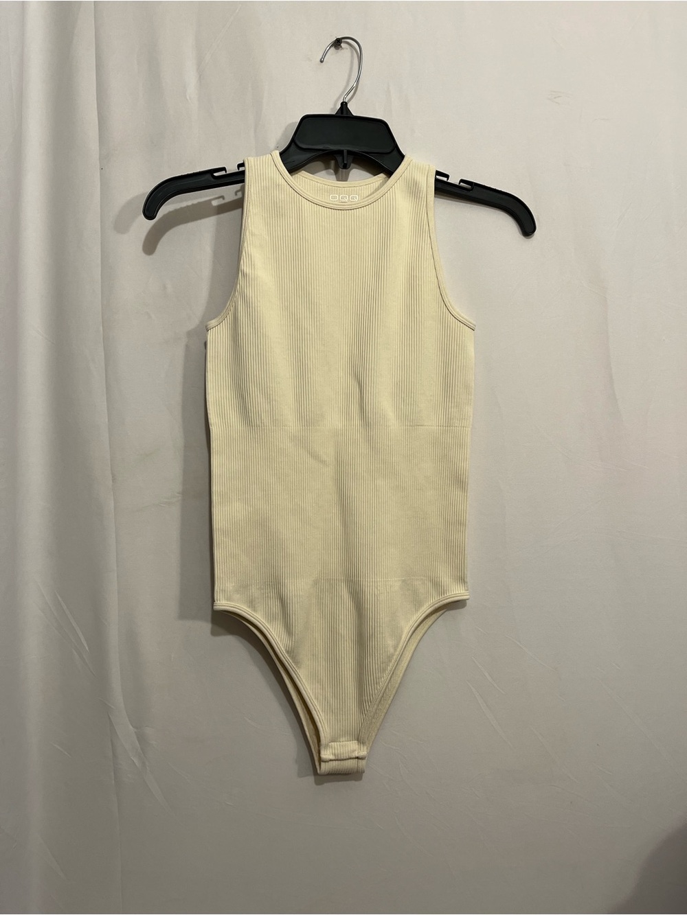 Sleeveless Ribbed Bodysuit in Cream